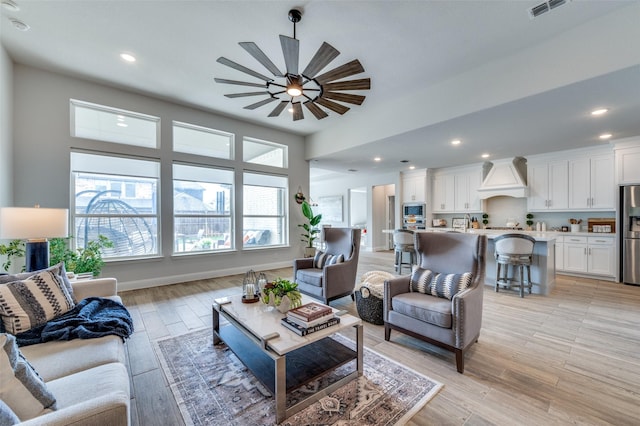 15625 Carnation Rd, Frisco, TX 75033 - living room featuring ceiling fan, recessed lighting, light wood-style flooring, and baseboards