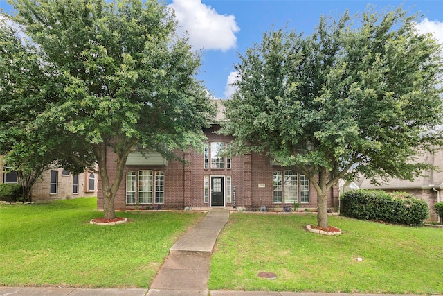 1528 Mill Creek Dr, Desoto, TX 75115 - obstructed view of property with brick siding and a front lawn