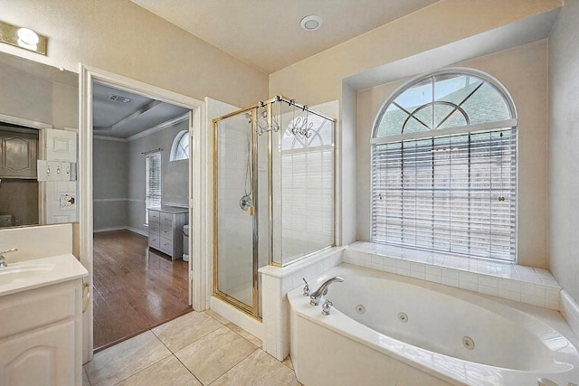 315 Hudson Falls Dr, Arlington, TX 76002 - full bathroom with a stall shower, a whirlpool tub, vanity, tile patterned flooring, and ornamental molding