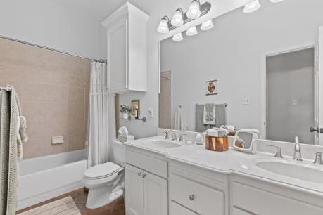 240 Lakeside Oaks Cir, Lakeside, TX 76135 - full bath featuring double vanity, toilet, shower / bath combo with shower curtain, and tile patterned flooring