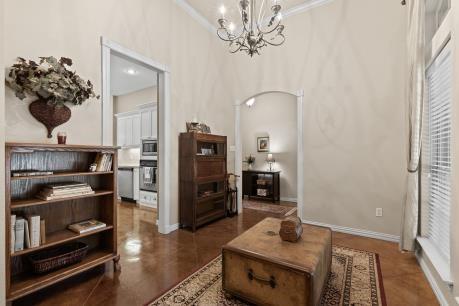 240 Lakeside Oaks Cir, Lakeside, TX 76135 - living area with a chandelier and ornamental molding