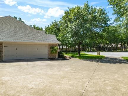 240 Lakeside Oaks Cir, Lakeside, TX 76135 - view of property exterior featuring brick siding and a garage