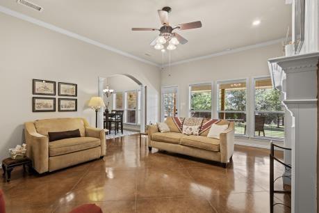 240 Lakeside Oaks Cir, Lakeside, TX 76135 - living area featuring ornamental molding and ceiling fan