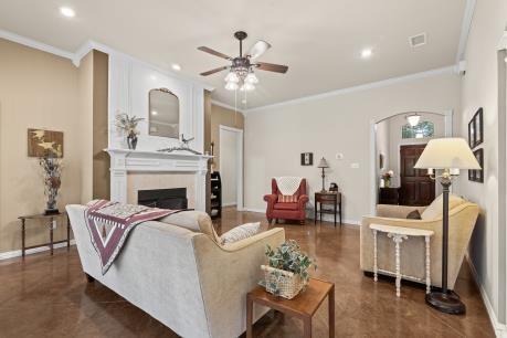 240 Lakeside Oaks Cir, Lakeside, TX 76135 - living area featuring crown molding, ceiling fan, baseboards, a fireplace, and recessed lighting
