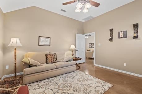 240 Lakeside Oaks Cir, Lakeside, TX 76135 - living area with a ceiling fan, vaulted ceiling, and baseboards