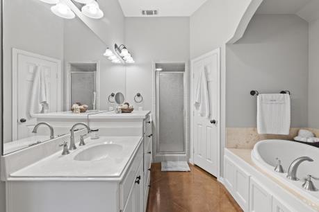 240 Lakeside Oaks Cir, Lakeside, TX 76135 - bathroom with a stall shower, vanity, and a garden tub