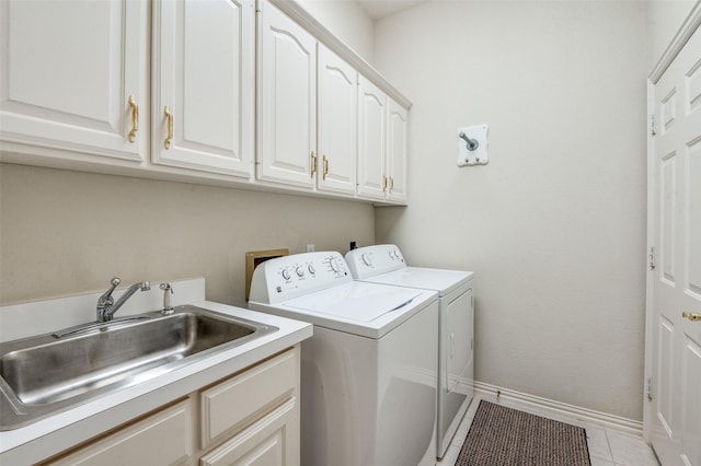 5909 La Cumbre Dr, Mckinney, TX 75072 - laundry room with washer and clothes dryer, cabinet space, light tile patterned floors, and baseboards