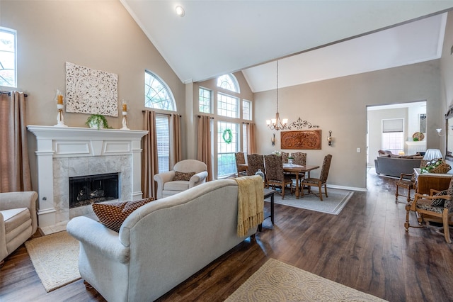 5909 La Cumbre Dr, Mckinney, TX 75072 - living area with a chandelier, high vaulted ceiling, dark wood-type flooring, and a fireplace