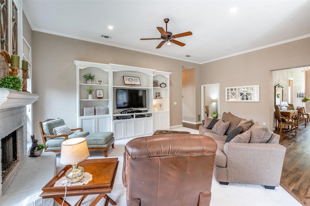 5909 La Cumbre Dr, Mckinney, TX 75072 - living area with a ceiling fan, crown molding, a fireplace, recessed lighting, and wood finished floors