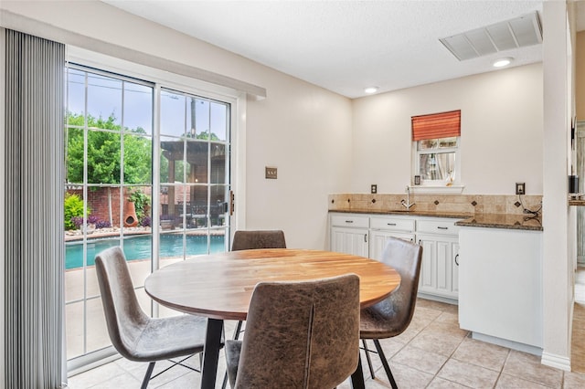 928 Rush Creek Rd, Keller, TX 76248 - dining room featuring light tile patterned floors and recessed lighting