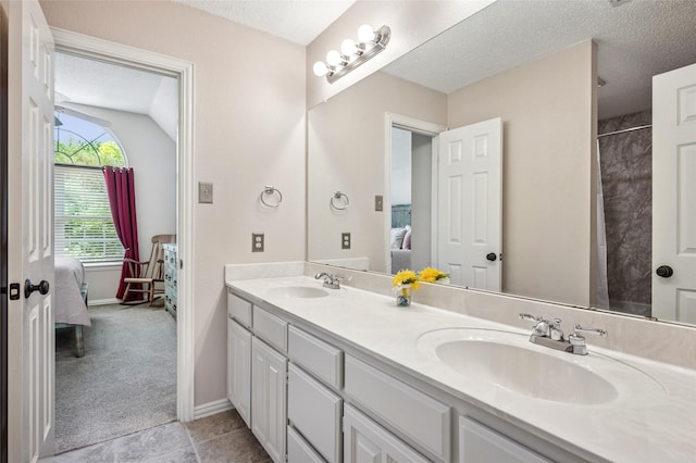 928 Rush Creek Rd, Keller, TX 76248 - ensuite bathroom with double vanity, a textured ceiling, baseboards, and a shower with shower curtain