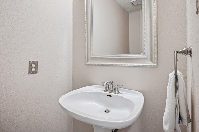 928 Rush Creek Rd, Keller, TX 76248 - bathroom featuring a sink and a textured wall