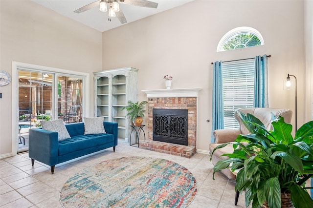 928 Rush Creek Rd, Keller, TX 76248 - living room with a towering ceiling, tile patterned flooring, a ceiling fan, baseboards, and a brick fireplace