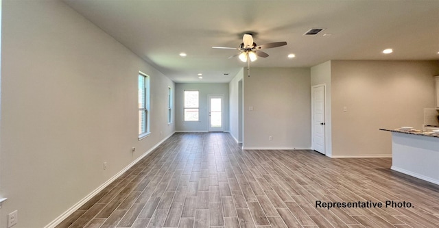 2006 Iris, Melissa, TX 75454 - unfurnished living room with a ceiling fan, wood finished floors, baseboards, and recessed lighting