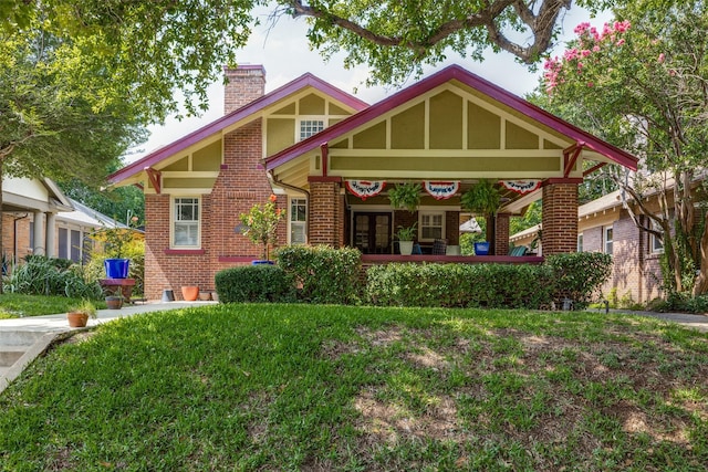 2220 Mistletoe Blvd, Fort Worth, TX 76110 - view of front facade featuring a chimney and brick siding
