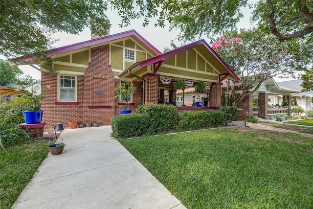 2220 Mistletoe Blvd, Fort Worth, TX 76110 - tudor-style house featuring brick siding, a front lawn, and a chimney