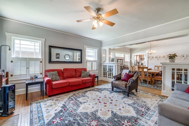 2220 Mistletoe Blvd, Fort Worth, TX 76110 - living area featuring wood finished floors, ceiling fan, a chandelier, baseboards, and ornamental molding