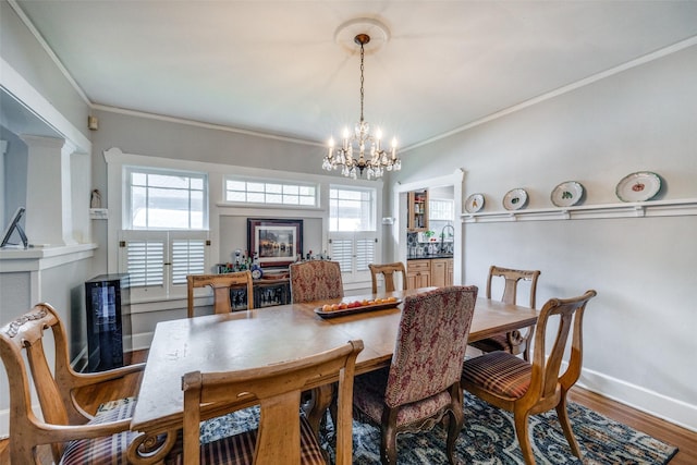 2220 Mistletoe Blvd, Fort Worth, TX 76110 - dining area featuring a chandelier, wood finished floors, crown molding, and baseboards