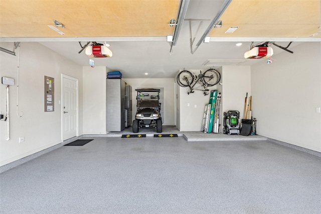 8229 Halifax, The Colony, TX 75056 - garage with a garage door opener and baseboards