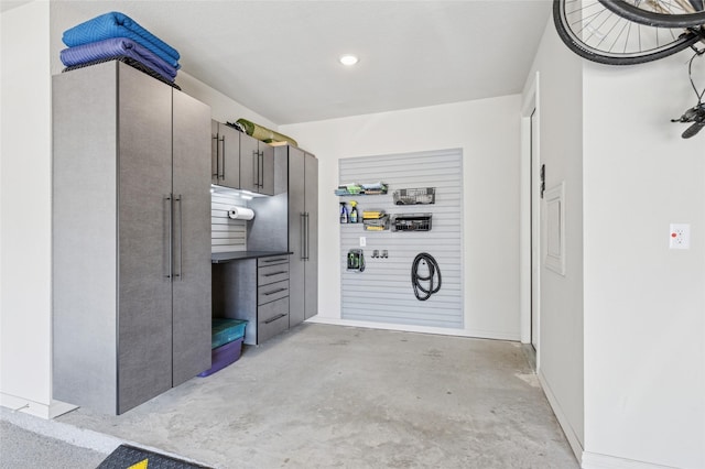 8229 Halifax, The Colony, TX 75056 - garage with baseboards and recessed lighting