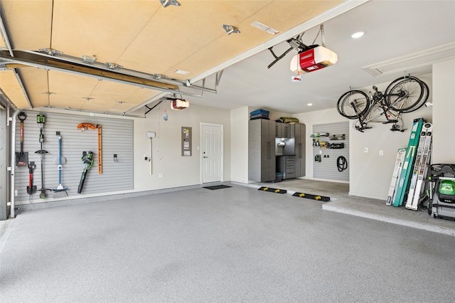 8229 Halifax, The Colony, TX 75056 - garage featuring a garage door opener, baseboards, and recessed lighting