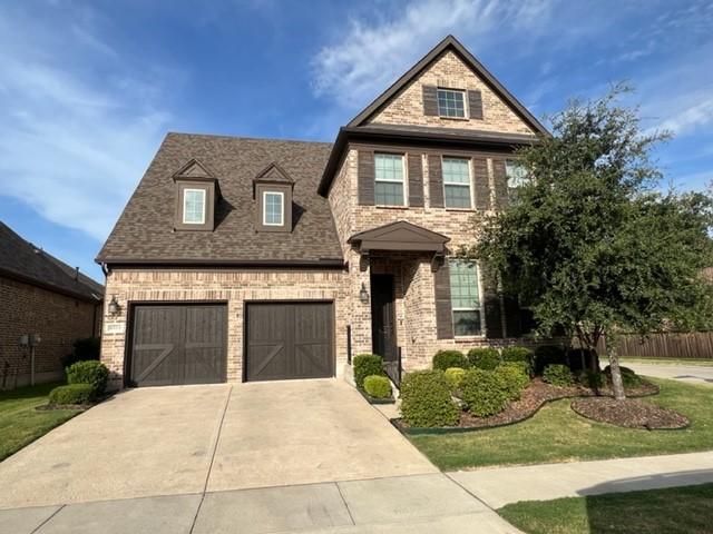 8533 Pine Valley Dr, Mckinney, TX 75070 - view of front of house with driveway and brick siding