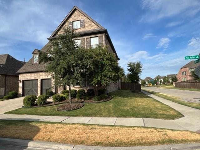 8533 Pine Valley Dr, Mckinney, TX 75070 - view of front facade featuring a garage, concrete driveway, and brick siding