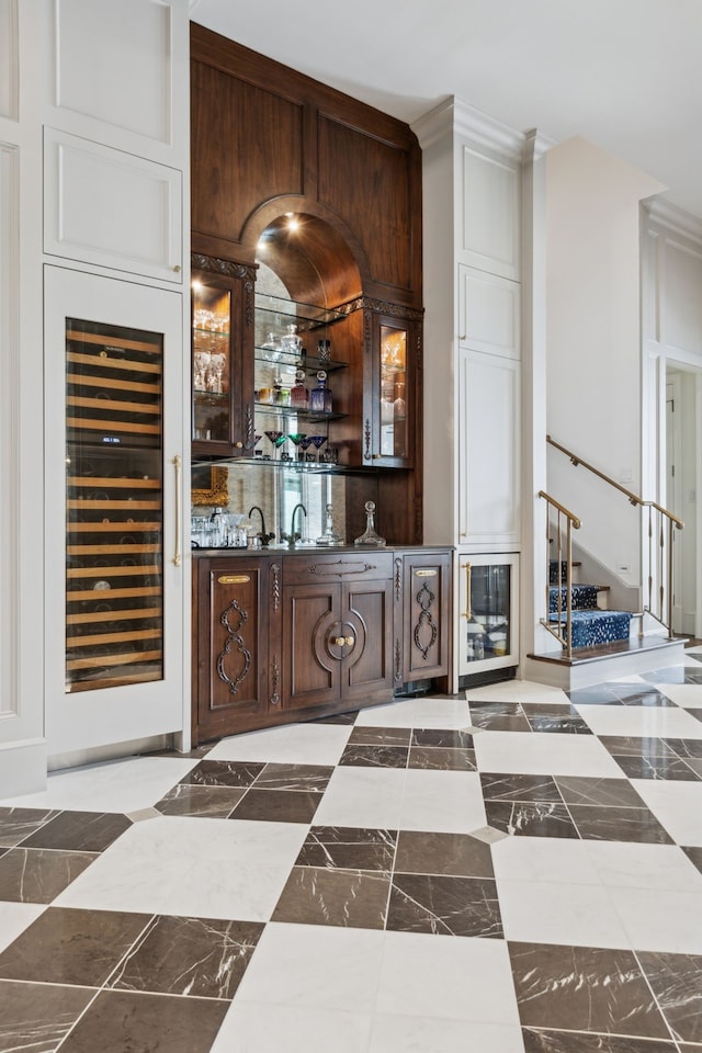 1481 Post Oak Trl, Southlake, TX 76092 - indoor wet bar with wine cooler, stairs, and crown molding