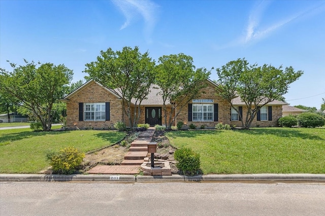 201 Wilson St, Whitesboro, TX 76273 - single story home with a front yard and brick siding