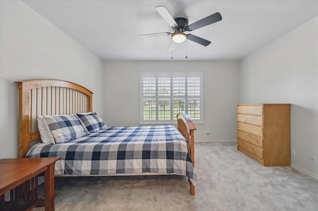 201 Wilson St, Whitesboro, TX 76273 - bedroom featuring light colored carpet, baseboards, and a ceiling fan