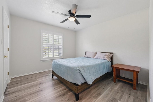 201 Wilson St, Whitesboro, TX 76273 - bedroom featuring light wood-style floors, baseboards, and ceiling fan