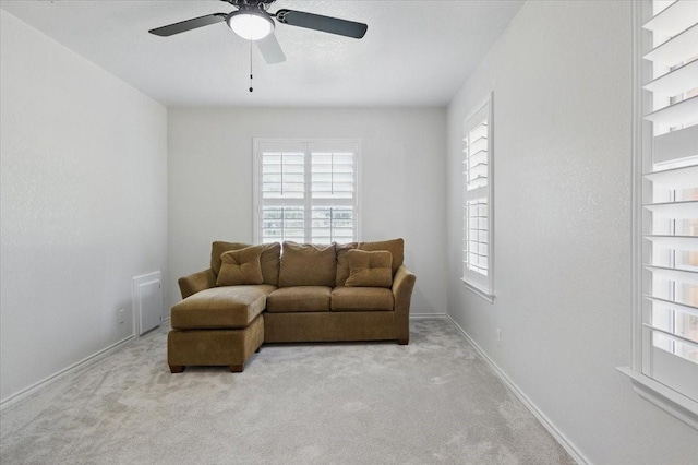 201 Wilson St, Whitesboro, TX 76273 - living area featuring a ceiling fan, carpet flooring, and baseboards