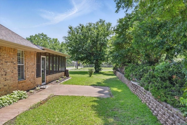 201 Wilson St, Whitesboro, TX 76273 - view of yard featuring a patio and a sunroom