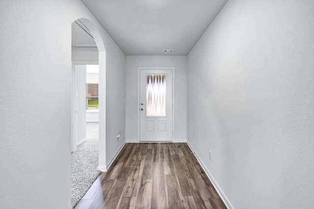 405 Watson Ct, Venus, TX 76084 - doorway with wood finished floors, arched walkways, and baseboards