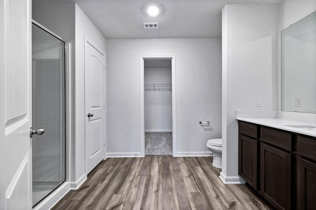 405 Watson Ct, Venus, TX 76084 - full bathroom featuring wood finished floors, toilet, vanity, and a stall shower