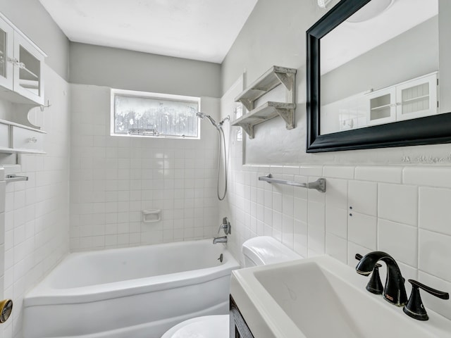 13439 Challaburton, Farmers Branch, TX 75234 - full bathroom featuring toilet, washtub / shower combination, tile walls, and vanity