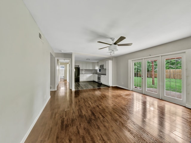 13439 Challaburton, Farmers Branch, TX 75234 - unfurnished living room featuring a ceiling fan, baseboards, and dark wood-style floors