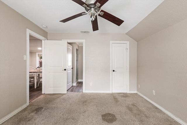 3200 Haltom Rd, Haltom City, TX 76117 - unfurnished bedroom with carpet floors, baseboards, a ceiling fan, and ensuite bathroom