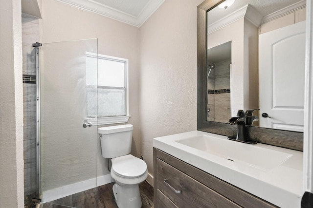 3200 Haltom Rd, Haltom City, TX 76117 - full bathroom with crown molding, toilet, vanity, wood finished floors, and a textured wall