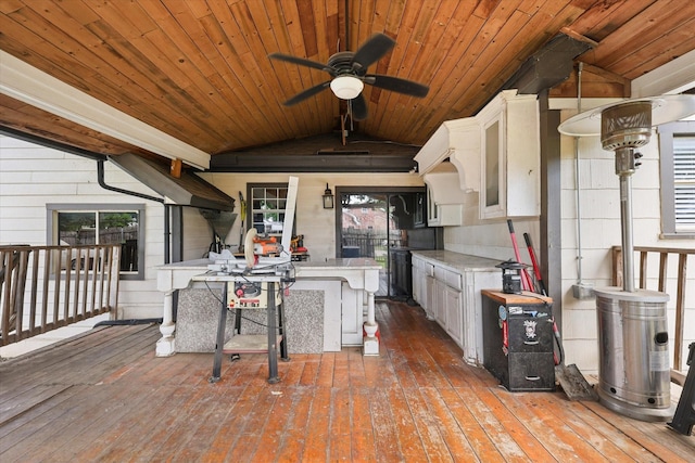 3200 Haltom Rd, Haltom City, TX 76117 - kitchen with ceiling fan, vaulted ceiling, wooden ceiling, light countertops, and white cabinets