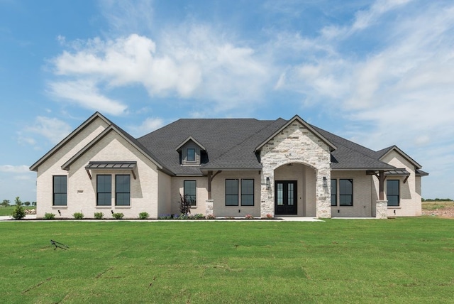 160 Maci Dr, Waxahachie, TX 75167 - french country inspired facade with a front yard, brick siding, french doors, and stone siding