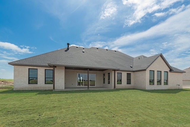 160 Maci Dr, Waxahachie, TX 75167 - rear view of property featuring a patio area, a lawn, brick siding, and a shingled roof