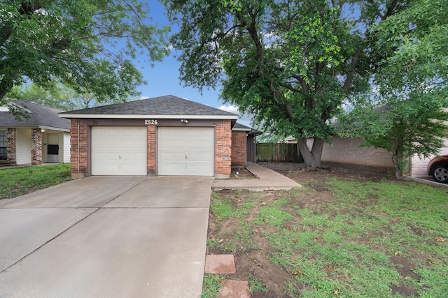 2526 Butterfield Dr, Fort Worth, TX 76133 - view of front of house featuring a garage, concrete driveway, and brick siding