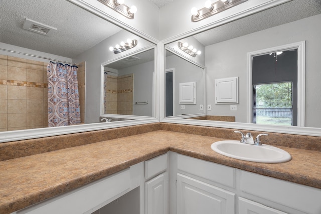 2526 Butterfield Dr, Fort Worth, TX 76133 - full bathroom featuring a textured ceiling, vanity, and a shower with shower curtain
