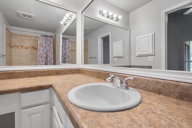 2526 Butterfield Dr, Fort Worth, TX 76133 - full bath with a textured ceiling, vanity, and curtained shower