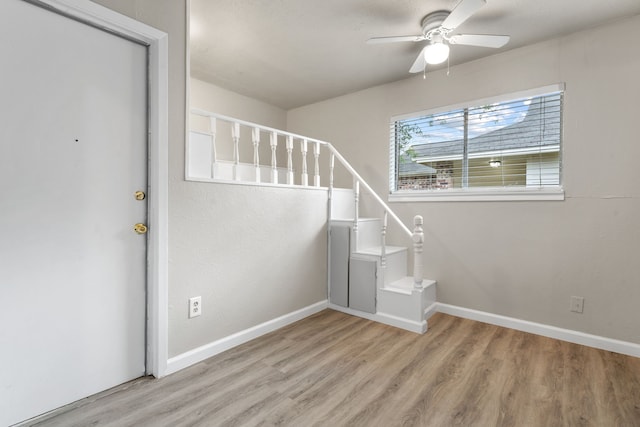 2526 Butterfield Dr, Fort Worth, TX 76133 - staircase featuring wood finished floors, ceiling fan, and baseboards