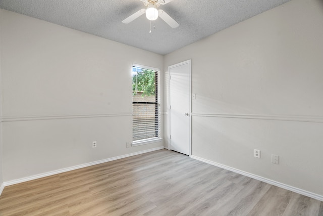 2526 Butterfield Dr, Fort Worth, TX 76133 - empty room featuring a textured ceiling, a ceiling fan, light wood-style flooring, and baseboards