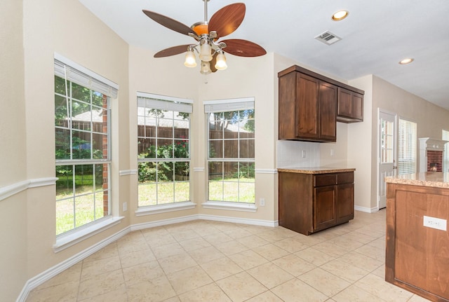 3010 Partridge Ln, Mckinney, TX 75072 - kitchen with a ceiling fan, light tile patterned flooring, healthy amount of natural light, and recessed lighting