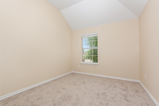 3010 Partridge Ln, Mckinney, TX 75072 - carpeted empty room featuring vaulted ceiling and baseboards