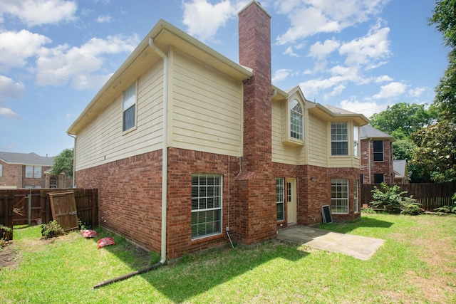 3010 Partridge Ln, Mckinney, TX 75072 - back of house with a chimney and brick siding